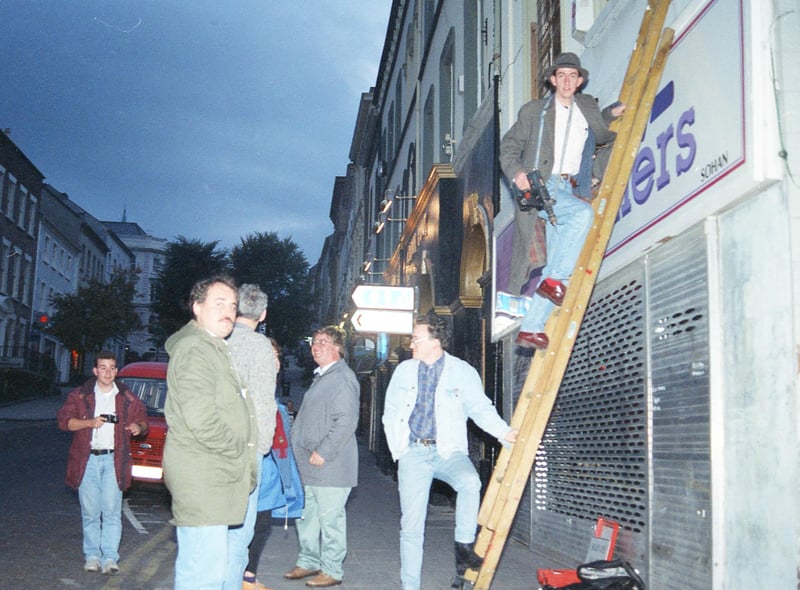 RUC officers arrive on the scene as the first city centre street signs in Irish are erected at Shipquay Street in 1992.