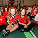 Pupils from Holy Family Primary School pictured during the visit from Derry City Conor Barr and Paul McMullan on Wednesday afternoon. Photo: George Sweeney