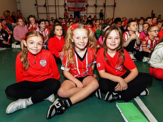 Pupils from Holy Family Primary School pictured during the visit from Derry City Conor Barr and Paul McMullan on Wednesday afternoon. Photo: George Sweeney