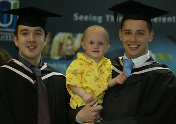 Proud dad Conor Brown (right) with his 13 month old son Ethan Shiels and friend Kevin Breslin when they were conferred with a BA hons in Electronics and Computing.  (1107JB46)