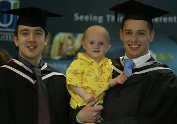 Proud dad Conor Brown (right) with his 13 month old son Ethan Shiels and friend Kevin Breslin when they were conferred with a BA hons in Electronics and Computing. (1107JB46)