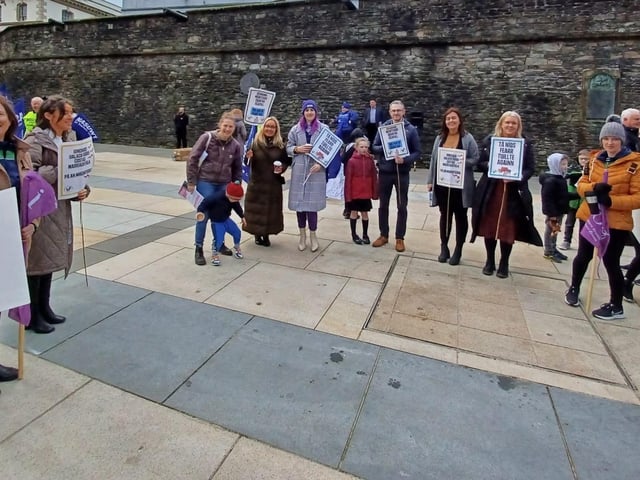 People gather ahead of the trade union rally on Tuesday.