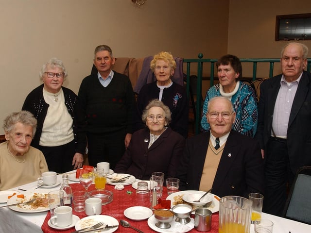 Seated from left, Brigid Lake, Sadie McQuigan, and Andrew McQuigan. Standing, from left, Margaret Lyle, Patrick Harkin, Mary McGeoghegan, Evelyn McMonagle, and Frank Cavanagh. (0912PG34) :Christmas parties for Derry's senior citizens in December 2003