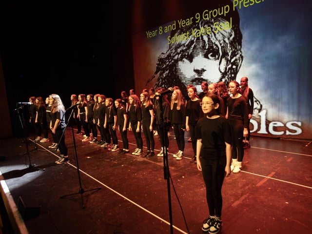 Year 8 and 9 pupils perform At the End of the Day from Les Miserables on Friday.