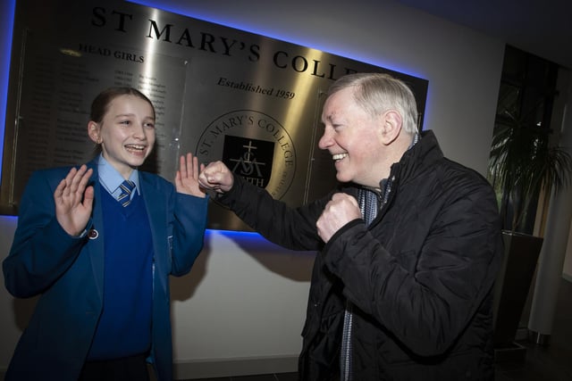 Derry boxing legend and granddad Charlie Nash pictured with his granddaughter and year 8 pupil at St. Mary’s College on Wednesday to celebrate Grandparents To School Day.