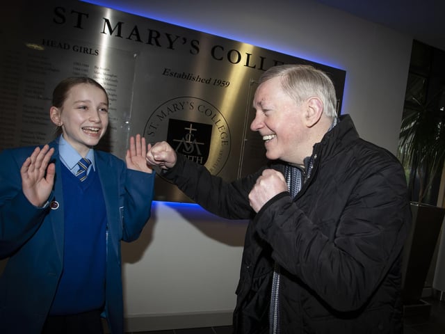 Derry boxing legend and granddad Charlie Nash pictured with his granddaughter and year 8 pupil at St. Mary’s College on Wednesday to celebrate Grandparents To School Day.