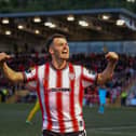 Derry City goalscorer Danny Mullen celebrates his second half strike in front of the North Stand. Photograph by Kevin Moore.