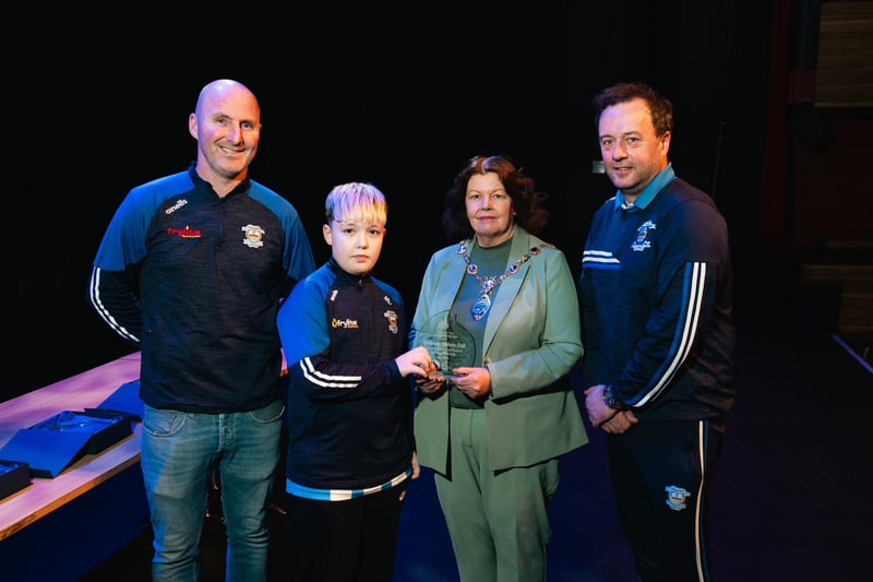 Derry City & Strabane District Council Mayor Patricia Logue making a presentation to 2010 coaches John Roulston, Martin McDaid and captain MJ Doherty, whose side won the Winter Cup. Photo: Karol McGonigle, Milkwood Studios.