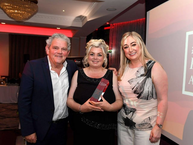 Spirit of Inishowen award winner Bernie Doherty receives her award from Louise Strain, Derry Journal and compere Adrian Logan. Photo: George Sweeney