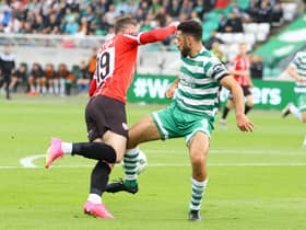 Derry City winger Ryan Graydon is caught by Shamrock Rovers defender Roperto Lopes in the first half at Tallaght. Photographs by Kevin Moore.