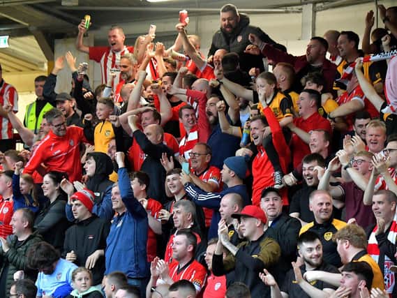 Fans celebrate Derry City’s win over KuPs at the Brandywell. Photo: George Sweeney. DER2330GS -