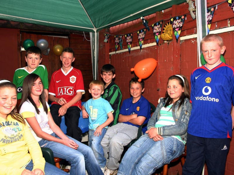 Damien pictured with a group of friends enjoying the Bar-B -Q party. 7432/dd : .