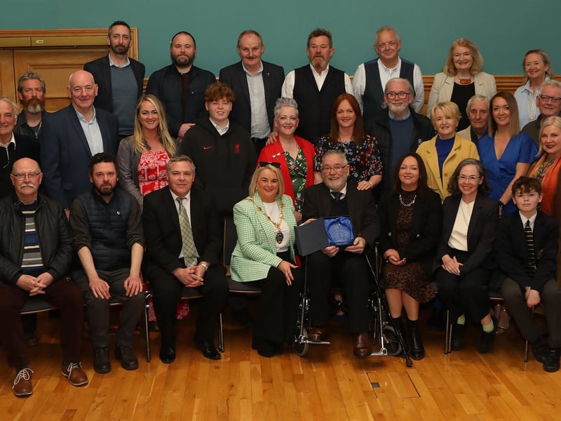 Mayor Sandra Duffy making a presentation to sculptor Maurice Harron, in recognition of his contribution as an art educator and artist in the City and District at a civic reception held in the Guildhall. Included are friends and family. (Photo - Tom Heaney, nwpresspics)