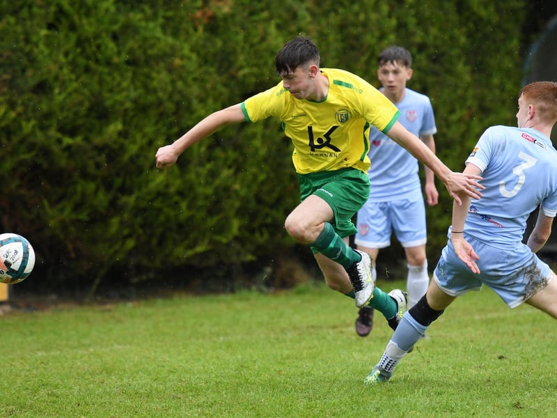 Donegal UL player Cathal Doherty hurdles this challenge from Derry City's Zhai Glackin during their O'Neills Foyle Cup Under-15's final at Ardmore.
