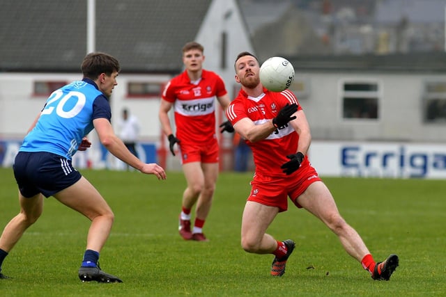 Derry’s Niall Loughlin gets to the ball ahead of Dublin’ s David Byrne. Photo: George Sweeney. DER2309GS – 42