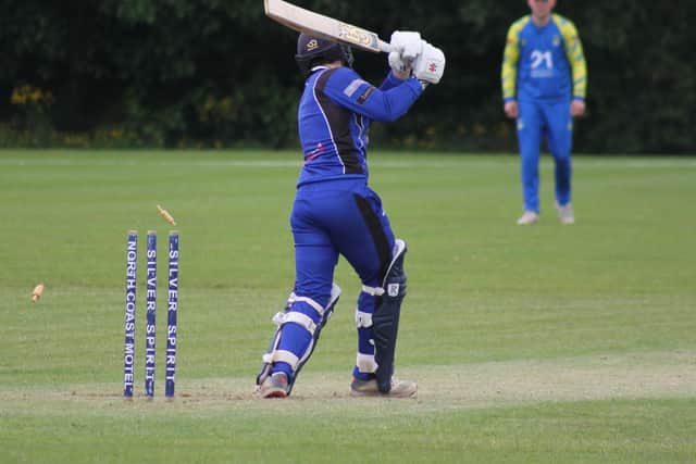 Coleraine's Marcus Poskitt is bowled by Donemana's David O'Sullivan. (Photo: Lawrence Moore)