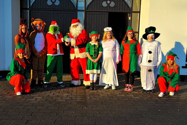 Santa, his helpers and the Galliagh Grinch were at the Galliagh Community Response Christmas Craft Fair held in Pio House Parish Centre on Saturday afternoon, in aid of Foyle Down Syndrome Trust.  Photo: George Sweeney. DER2250GS – 90