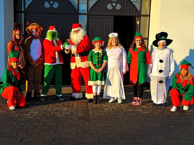 Santa, his helpers and the Galliagh Grinch were at the Galliagh Community Response Christmas Craft Fair held in Pio House Parish Centre on Saturday afternoon, in aid of Foyle Down Syndrome Trust. Photo: George Sweeney. DER2250GS – 90