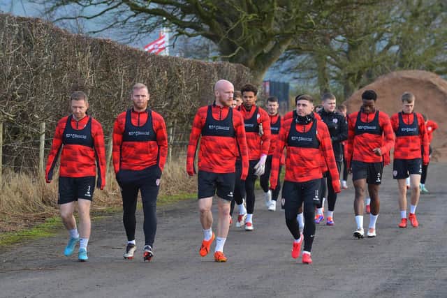 The new-look Derry City squad make their way to training at the GAA Centre of Excellence, Owenbeg.  Photograph: George Sweeney