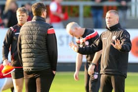 Derry City assistant manager Alan Reynolds talks to Ruaidhrí Higgins during the pre-match warm-up at St Patrick's Athletic.
