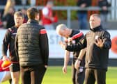 Derry City assistant manager Alan Reynolds talks to Ruaidhrí Higgins during the pre-match warm-up at St Patrick's Athletic.