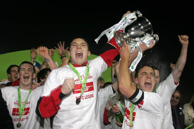 Kevin Deery and Mark McChrystal hold aloft the First Division trophy at Gortakeegan Park in 2010.