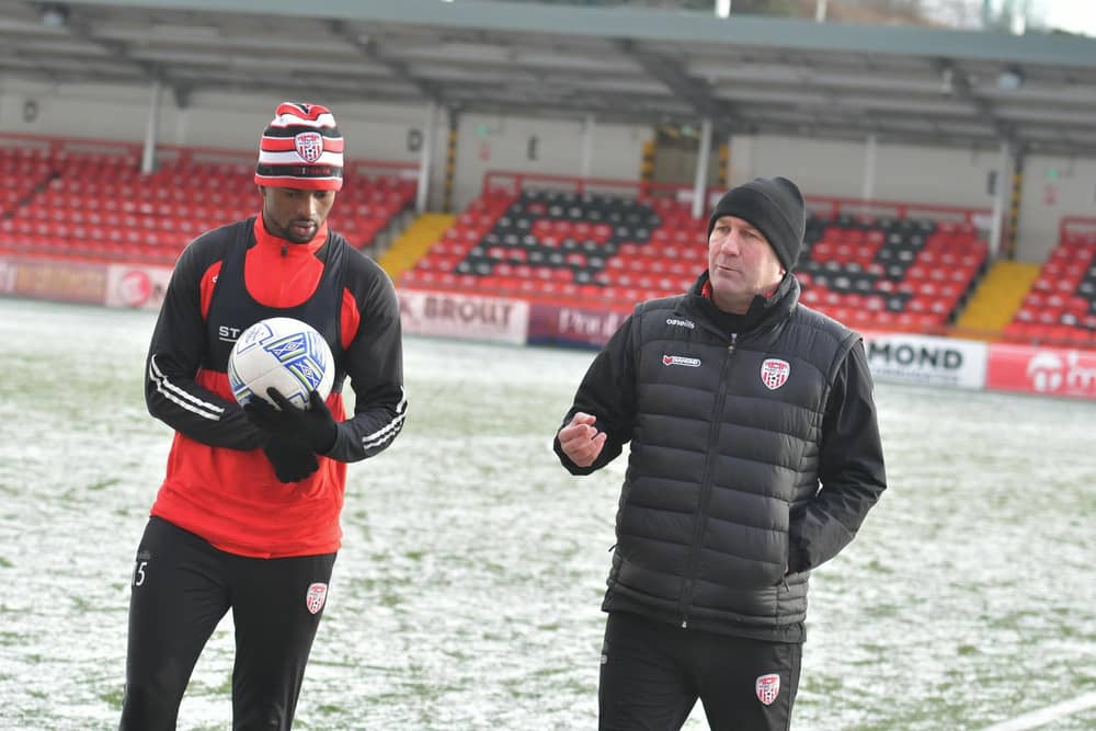 Alan Reynolds, Derry City assistant boss talks to midfielder Sadou Diallo during pre-season training.
