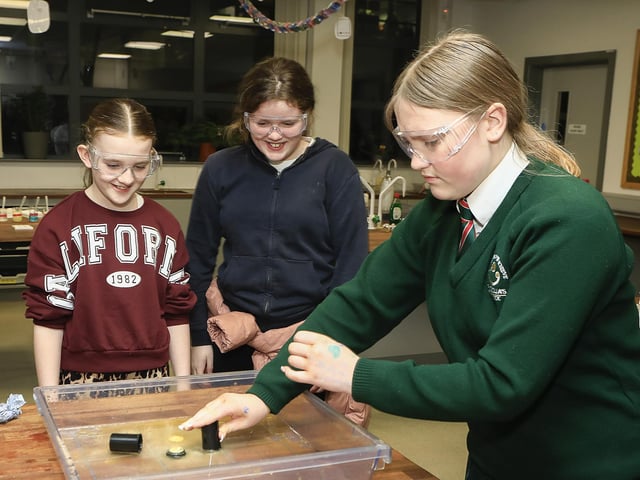Student Rhema Roberts with P7 pupils in the Science Department at St. Cecilia’s College Open Night. (Photo - Tom Heaney, nwpresspics)