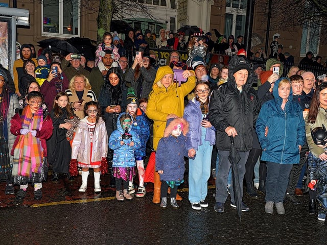 Spectators line the route of the Halloween carnival parade ‘On the Ninth Wave’ on Monday evening. Photo: George Sweeney.  DER2244GS – 078
