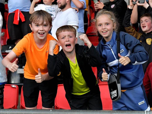 Derry City fans celebrate Will Patching’s winning goal against against Sligo Rovers on Friday evening. Photo: George Sweeney. DER2327GS – 074