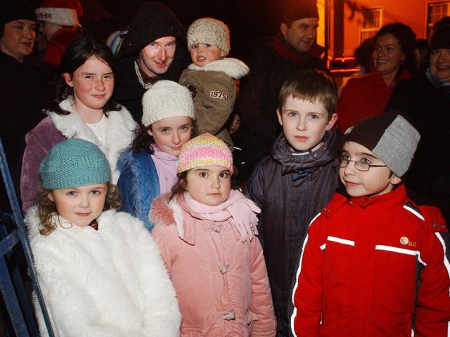 All wrapped up as they wait to see Santa are, front from left, Aine Doherty, Michael McLaughlin, Roma McLaughlin, Sorcha McLaren, Conor Doherty, and Lorcan McLaren. Back row, from left, Micky and Shea McLaughlin. (0612PG60)                                : Christmas in Inishowen in 2005.