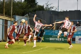 Derry City winger Michael Duffy rises to head Paul McMullan's cross into the net for the equalising goal in Drogheda. Photographs by Kevin Morrison.