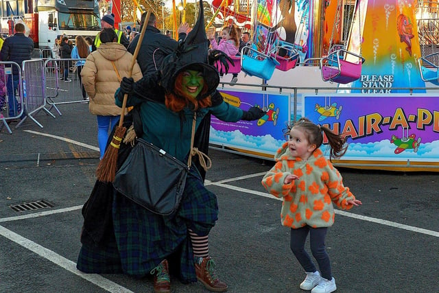 Young Eabha Molloy dancing with Winifred the Witch at Cullen's Halloween Funfair in Ebrington Square. Photo: George Sweeney.  DER2243GS – 063