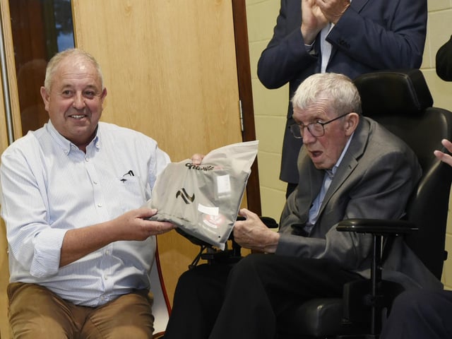 John Keenan, Derry GAA Chairman, presents Gerard Forrest with his commemorative shirt.