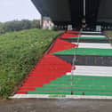 Yellow paint was spattered all over several flights of steps painted in the Palestinian colours in solidarity with the people of Gaza in April.