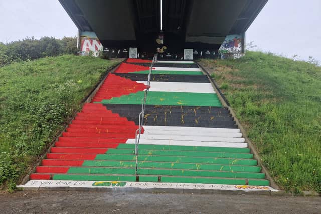 Yellow paint was spattered all over several flights of steps painted in the Palestinian colours in solidarity with the people of Gaza in April.