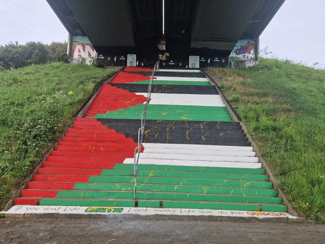 Yellow paint was spattered all over several flights of steps painted in the Palestinian colours in solidarity with the people of Gaza in April.
