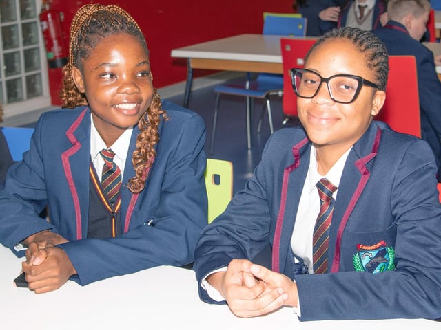 HAPPY FACES. . . .Two of the new Year 8 intake at Oakgrove Integrated College on Monday. : Oakgrove Integrated College welcomes latest influx of Year 8 pupils