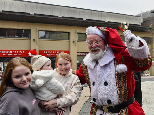 Santa arrives at the Richmond Shopping Centre on Sunday afternoon. Photo: George Sweeney