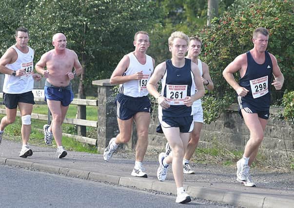 This group of runners passing are Trevor Dallas (143), Danny McMonagle (193), Mark Donnelly (261) and Conal Creagh (298). (1609T54).:.