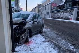 A car damaged at the bottom of Fountain Hill.