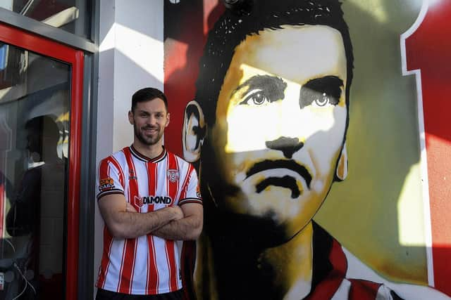 New City striker Pat Hoban pictured beside the Mark Farren mural at Brandywell. Photo: George Sweeney