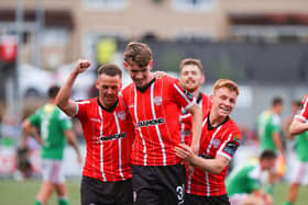 Teenager Tiernan McGinty celebrates his debut goal with Ben Doherty and Brandon Kavanagh. Photograph by Kevin Moore.