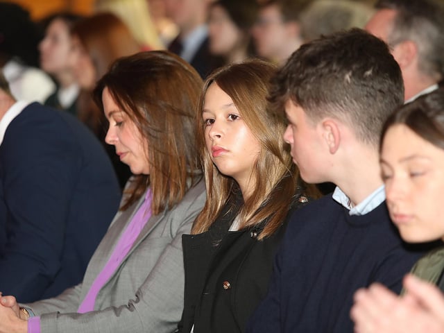 John Hume's grand-daughter, centre, introduced Bill Clinton at the Guildhall.
