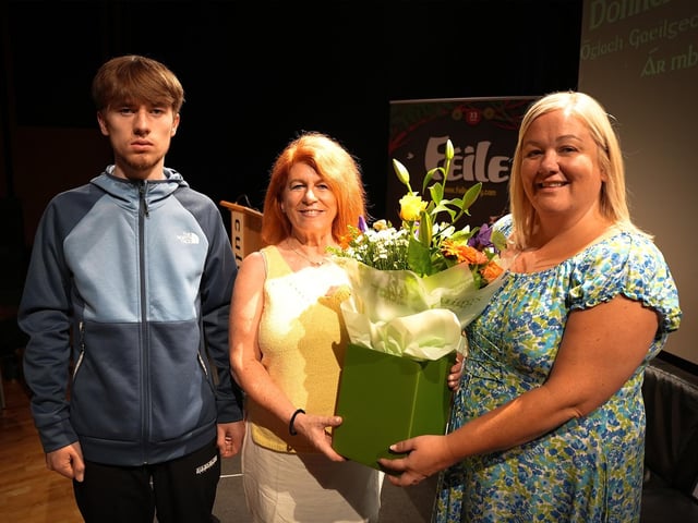 The late Donncha's partner and son, Karen and Jude receiving a bouquet of flowers on Tuesday afternoon from Mary Nic Ailin.