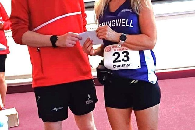 Christine Bonham picking up her prize for her age category win at the Stunnerz n Runnerz 5k