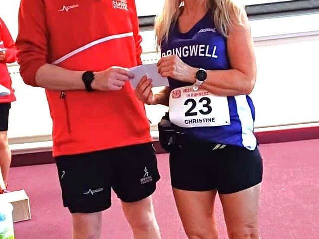 Christine Bonham picking up her prize for her age category win at the Stunnerz n Runnerz 5k