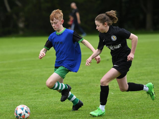 A Top Of The Hill Celtic and Donegal Ladies League player in a race for the ball during their under-13's match at Lisnagelvin.