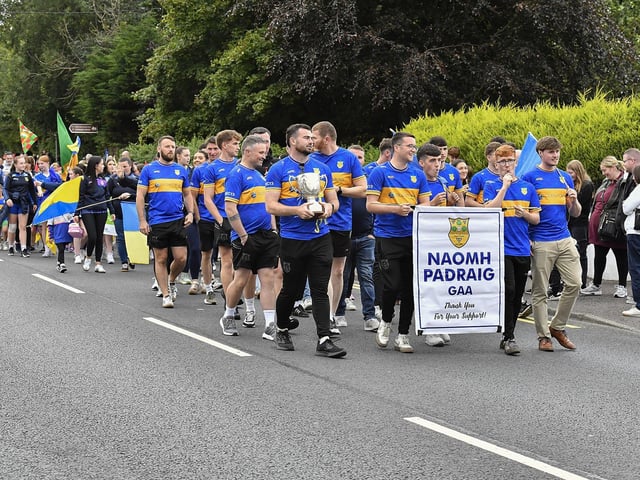 Muff Feile opening parade makes its way through the village on Friday evening. Photo: George Sweeney