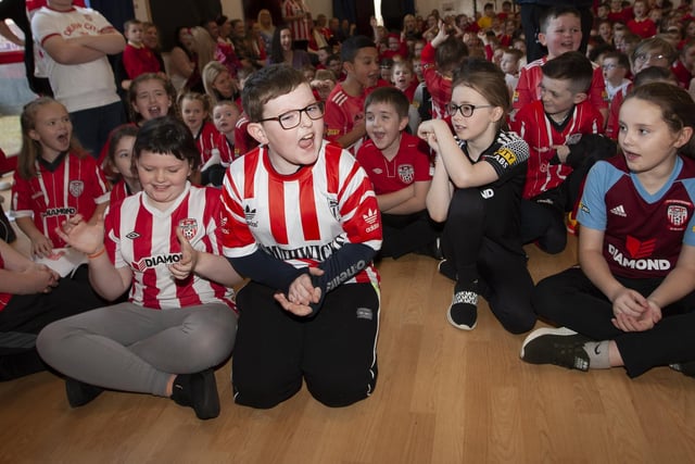 Young Steelstown Primary School Pupils gets excited during the visit of Derry City players Shane and Patrick McEleney and Michael Duffy on Tuesday. (Photos: Jim McCafferty)